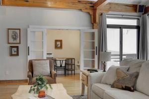 a living room with a couch and a table at Quinn Peaks Retreat House in Bozeman