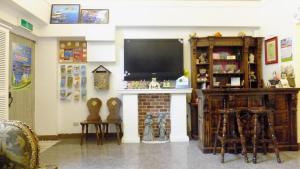 a living room with a tv and a fireplace at Gloria House in Hualien City