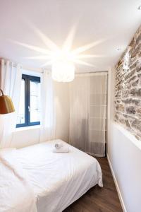 Katil atau katil-katil dalam bilik di Le refuge - Résidence Hestia