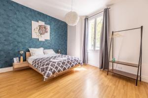 Posteľ alebo postele v izbe v ubytovaní F2 Chamalières Av Thermale (B)