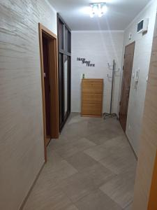 a hallway with a dresser in a room at Apartament do wynajęcia in Olecko