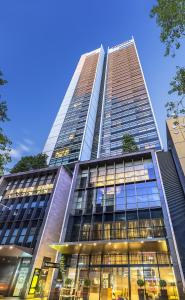 a tall building with a lot of windows at Fraser Suites Sydney in Sydney