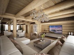 a living room with a couch and a chandelier at Royal Chalet Donovaly in Donovaly