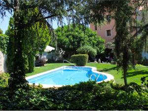 a swimming pool in the yard of a house at HOSTAL LA SAVINA in Cervera