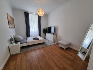 En eller flere senge i et værelse på Süße Marie 1 + 2 billeder