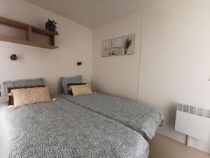 a bedroom with a large bed in a room at Chalet Hohllay in Reisdorf