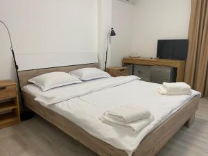 Un pat sau paturi într-o cameră la Casa Adan
