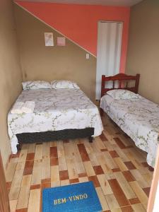 Letto o letti in una camera di Pousada Aconchego