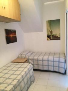A bed or beds in a room at Marina Capo Pino