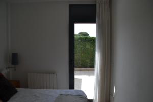 Posteľ alebo postele v izbe v ubytovaní Cosy apartamento en Sagaró, Costa Brava