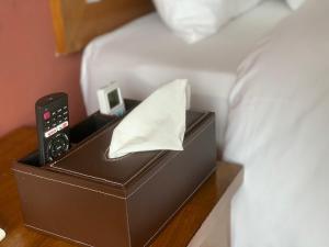 Postel nebo postele na pokoji v ubytování Tiger Sapa hotel
