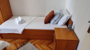 Postel nebo postele na pokoji v ubytování Deluxe Apartman Pervan