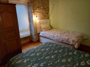 Cama o camas de una habitación en A CASA de FLORINDA