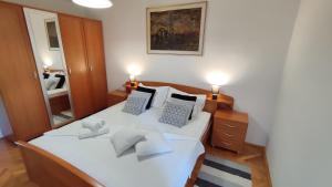 Posteľ alebo postele v izbe v ubytovaní Deluxe Apartman Pervan