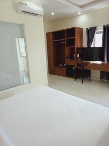 Ένα ή περισσότερα κρεβάτια σε δωμάτιο στο Hoàng Anh Côn Đảo Hotel