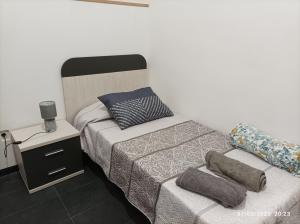Postel nebo postele na pokoji v ubytování Casa La Isleta, entre el puerto y la playa Las Canteras