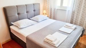 Postel nebo postele na pokoji v ubytování Apartment Merry Center & Beach