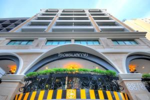 a building with a balcony in front of it at Aspira Skyy Sukhumvit 1 in Bangkok