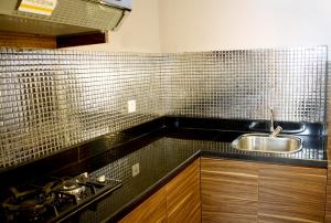 A kitchen or kitchenette at Pranaya Boutique Hotel