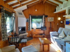 a living room with a couch and a table at Casa con encanto en Muros, Esteiro in Solleiros