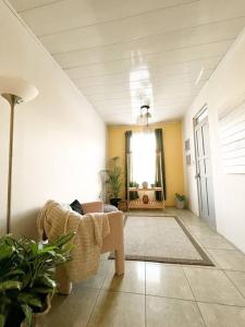 a living room with a couch and a table and a window at Casa Boho in Quesada