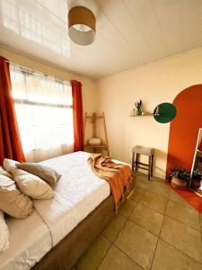 a bedroom with a large bed and a window at Casa Boho in Quesada