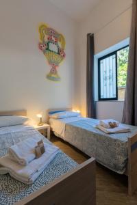 Cortile dei Giusti - Combo Guesthouse客房内的一张或多张床位