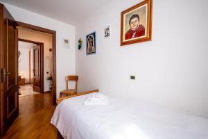 Postel nebo postele na pokoji v ubytování Apartment with bicycle storage in Dongo - Larihome A24 + 12 fotografií