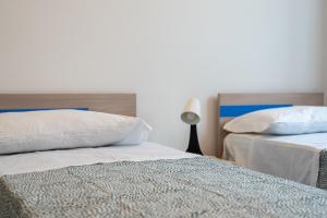 Cortile dei Giusti - Combo Guesthouse客房内的一张或多张床位