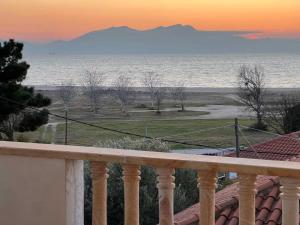a view of the ocean from the balcony of a house at Heraklia villa sea view in Nea Irakleia