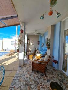 a living room with a couch and a table at Casa de los Suenos Granada in El Turro