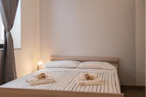 Cortile dei Giusti - Combo Guesthouse客房内的一张或多张床位