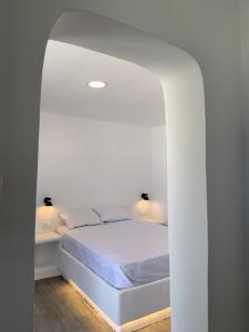 Postel nebo postele na pokoji v ubytování Juli’s Suites