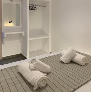 Postel nebo postele na pokoji v ubytování Juli’s Suites