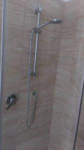 a shower with a glass door in a bathroom at A Due Passi Dal Treno in Pisa