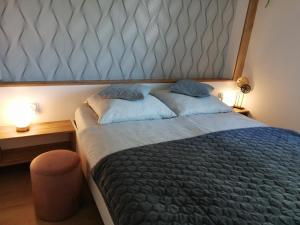 Posteľ alebo postele v izbe v ubytovaní Apartament Zielone Wzgórze 2