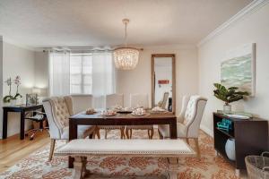 a dining room with a table and chairs at Beach 2 level spacious condo in Fort Lauderdale