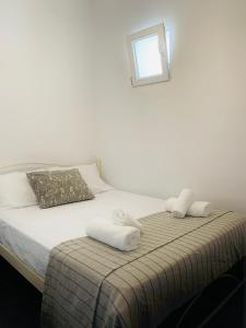 Postel nebo postele na pokoji v ubytování Juli’s Suites