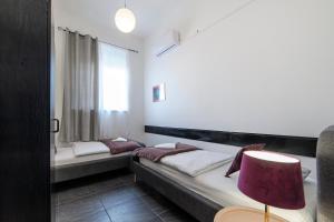 Postel nebo postele na pokoji v ubytování Hostel Globo
