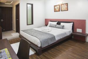 Postel nebo postele na pokoji v ubytování Hotel Pearls