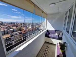 a balcony with a view of a city at Harmony Apartment in Belgrade