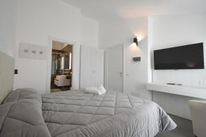 Ένα ή περισσότερα κρεβάτια σε δωμάτιο στο CAVOUR ROOMS