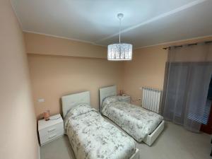 Postel nebo postele na pokoji v ubytování Residenza Punta Acquabella