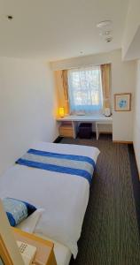 En eller flere senger på et rom på Hotel KOYO Bekkan - Vacation STAY 36956v