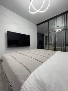 Postel nebo postele na pokoji v ubytování Апартаменты на Крылова-Ауэзова