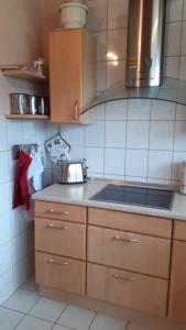 a kitchen with a sink and a counter top at Ferienwohnung Silk in Niederkrüchten