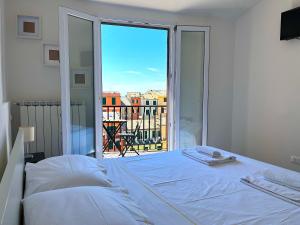 Postel nebo postele na pokoji v ubytování Pellegrino Rooms