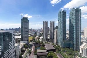 a city skyline with tall skyscrapers at The Westin Manila in Manila