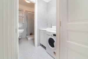 a bathroom with a washing machine and a sink at La Casa di Adalgisa in Fasano