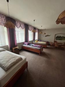 a bedroom with two beds and a living room at Pension für Monteure in Leisnig in Leisnig